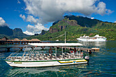 Guests of Paul Gauguin cruise anchored in Moorea, Cook's Capitan Bay, French Polynesia, Society Islands, South Pacific.