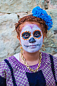 participant on a carnival of the Day of the Dead in Oaxaca, Mexico