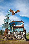 Oregon Welcomes You sign at California-Oregon border on Highway 97 near Klamath Falls, Oregon.