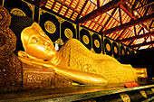 Reclining Buddha at Wat Chedi Luang Wora Wihan Buddhist temple in Chiang Mai, Thailand.