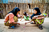 Cham children playing games, Chau Doc, Vietnam. Final day in the Mekong Delta. We visited a cham minority village. When these children realised we weren’t going to buy their heart shaped waffles that, according to a sign, would give us ”cronic”, they returned to paying their games. Had fun and games on the Cambodian border after, on instruction, our group refused to pay the extra dollar demanded by the border control guy. Not a happy man…