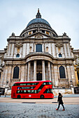 Red London Bus in front of St Pauls Cathedral, City of London, London, England