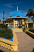 The colorfully painted gazebo in the main plaza in Chapab de las Flores in Yucatan, Mexico.