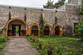 The restored monastery in the ruins of the old colonial church of San Francisco Asis in the village of Kikil, Yucatan, Mexico.