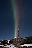 Vertical multi coloured stripes of the Aurora Borealis (Northern Lights) over Tungeneset Lighthouse, Tungeneset, Senja, Troms og Finnmark county, Norway, Scandinavia, Europe