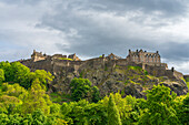 Low angle view of Edinburgh Castle perched on rocks, Edinburgh, Scotland, United Kingdom, Europe