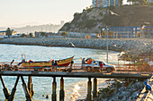 Boat being transported on pier at Caleta Portales, Valparaiso, Valparaiso Province, Valparaiso Region, Chile, South America