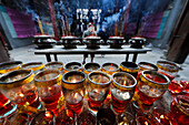 The Thien Hau Temple, the most famous Taoist temple in Cholon, red candles and incense sticks on joss stick pot burnt to pay respect to the Buddha, Ho Chi Minh City, Vietnam, Indochina, Southeast Asia, Asia Vietnam.