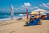 View of sunshades on sunny morning on Kuta Beach, Kuta, Bali, Indonesia, South East Asia, Asia