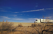 Truck Driving Through Mojave Desert