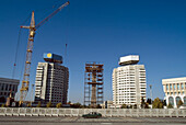 Crane On Construction Site Near Office Buildings