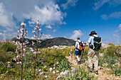 Two Hikers On Track Towards Teix Peak