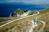 UK, England, Durdle Door; Dorset, Rear View, Boy Walking Down Footpath