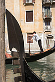 Gondolier And Gondolas In San Marco District