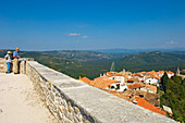 People Looking At View Of Motovun Rooftops, Istria,Croatia