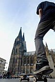 Man Skateboarding Near Cologne Cathedral (Kolner Dom),Low Angle View, Cologne,Germany