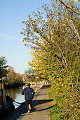Man Jogging Along Regents Canal, London,England,Uk