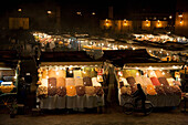 View Over Stalls Lit Up At Night In Djemaa El Fna, Marrakesh,Morocco