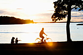Silhouettes Of People At Lake Malaren Shore, Sundbyholm Manor,Sweden