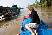 Young Woman Enjoying Boat Trip In Mekong Delta, Vinh Long,Vietnam