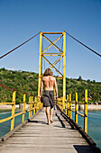 Male Tourist On Bridge To Nusa Cenida