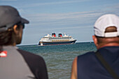 Two Men Watching Cruise Ship