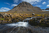 A Small Stream Flowing Out From The Mountains Along The Strandir Coast; West Fjords, Iceland