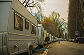 Camping Trailers Parked In A Row Along A Street With Electrical Lines And Hoses For Hook Up; Locarno, Ticino, Switzerland