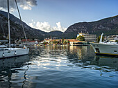 Houses and boats along the Bay of Kotor; Kotor, Montenegro