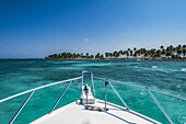 Vibrant turquoise ocean and the bow of a boat; Belize
