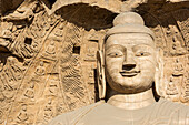 Carved Buddhist statues at Yungang Grottoes, ancient Chinese Buddhist temple grottoes near Datong; China