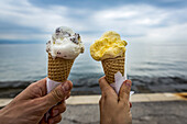 Couple with ice cream cones; Opatija, Primorje-Gorski Kotar County, Croatia