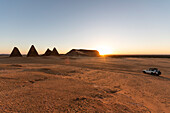 Field of Kushite royal pyramids and Mount Jebel Barkal at sunrise; Karima, Northern State, Sudan