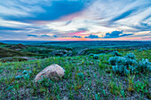 Vast landscape stretching to the horizon at sunset in Grasslands National Park; Val Marie, Saskatchewan, Canada