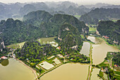Drone view of Ninh Binh along the shoreline; Ninh Binh, Ninh Binh Province, Vietnam