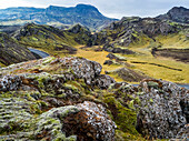 A road winds through the rugged terrain of Southern Iceland; Grimsnes- og Grafningshreppur, Southern Region, Iceland