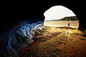 Person in Sea Cave at Low Tide Bay of Fundy, New Brunswick Canada