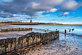 Herd Groyne Lighthouse and pier along the shoreline of the River Tyne; South Shields, Tyne and Wear, England, United Kingdom