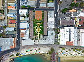 Views over California's famous island, Catalina Island, with a crowded beach; Avalon, California, United States of America