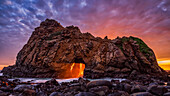Keyhole Rock at sunset, on Pfeiffer Beach, which is along the Big Sur coast of California; California, United States of America