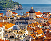 Skyline of Dubrovnik and the coastline along the Adriatic Sea with the dome and cross of the Dubroknik Cathedral; Dubrovnik, Croatia