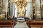 Interior of the nave and altar of the Misericodia Church with elaborate artwork and decorative pillars and moldings in the Parish of Se; Angra do Heroismo, Terceira, Azores