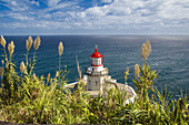 The Farol do Arnel Lighthouse at Ponta do Arnel near Nordeste overlooking the Atlantic Ocean; Sao Miguel Island, Azores