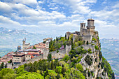 Guaita Tower on the peak of Mount Titan with a cloud filled sky on a sunny day;  Republic of San Marino, North-Central Italy