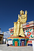 Giant gold plated statue of a seated Buddha at Likir Monastery above the Indus Valley, in the Himalayan Mountains, Jammu and Kashmir; Likir, Ladakh, India