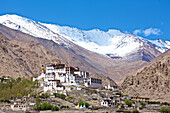 Likir Monastery with its giant gold plated statue of a seated Buddha watches over from above the Indus Valley, in the Himalayan Mountains of Ladakh, Jammu and Kashmir; Likir, Ladakh, India