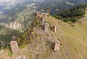 Aerial view of the tower houses at the mountaintop medieval fortress of Keselo that overlook the village of Omalo in the Tusheti National Park; Omalo, Kakheti, Georgia