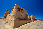 The San Estevan del Rey Mission Church built with traditional adobe in a mixture of Spanish Colonial and Puebloan architectural styles, located in the ancient indigenous community of Acoma Pueblo; Acoma, New Mexico, United States of America