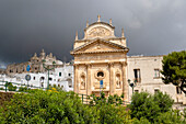 The Church of Carmine and moody sky in Ostuni (The White City); Ostuni, Puglia, Italy