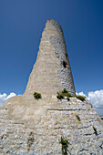 Torre del Serpe, near Otranto against a blue sky; Otranto, Puglia, Italy
